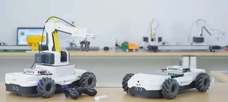 How Dobot Robotics Will Change STEM Education in the Future 5 obot Magician E6 robotic arm performing a 3D printing task in a classroom setting."